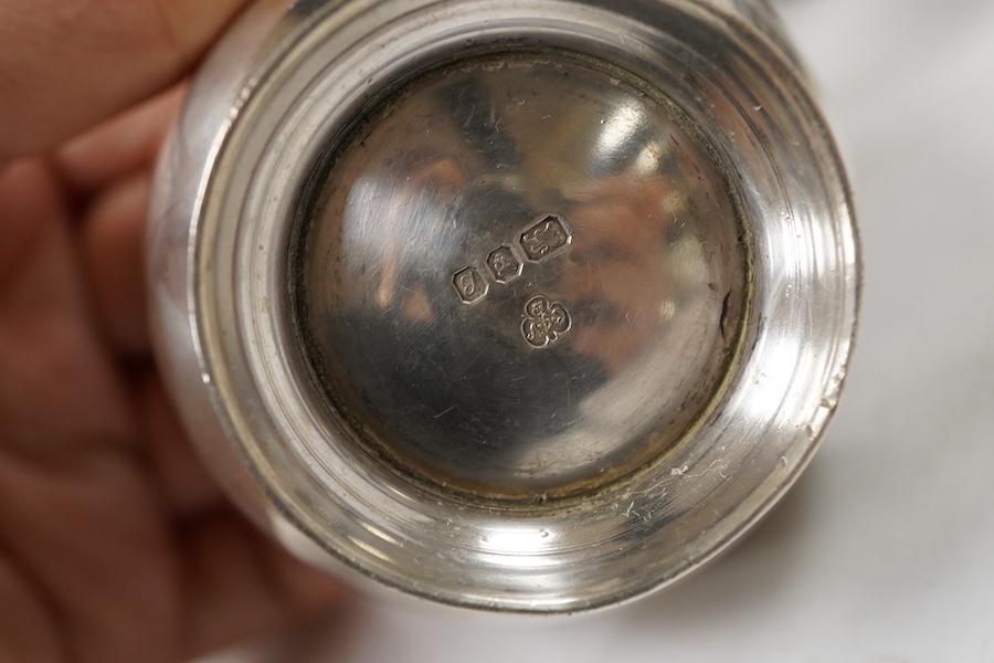 Sundry silver, consisting of - a modern tea strainer and stand, bu C.J. Vander Ltd, an egg cup, small goblet, three serviette rings, a stand and a match box case.